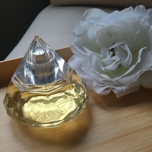 Elegant Crystal Perfume Bottle with Gold Hue